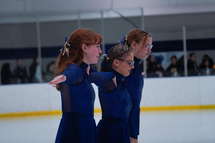 Three skaters connecting their arms on Jan. 20, 2023.
