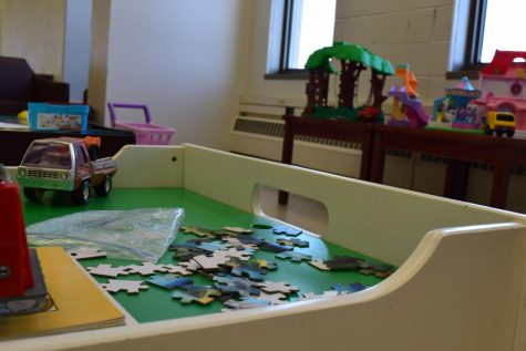 Puzzle pieces are scattered in the family-friendly area of the library after dedicated family study hours launched last week.