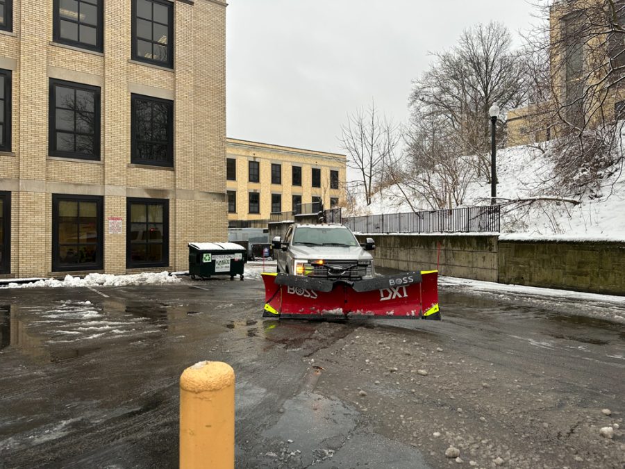 Near Kent Hall, a truck works to clear the parking spots of snow and ice on Jan. 25, 2023.