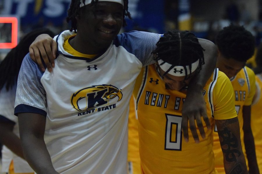 Kent State senior Julius Rollins walks off the court with his teammate after the 74-68 win against Buffalo University on Jan. 27, 2023. 