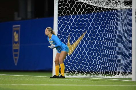 Kent State sophomore soccer player Heidi Marshall guards the goal for Kent State University. She says playing soccer has helped her build resilience. 