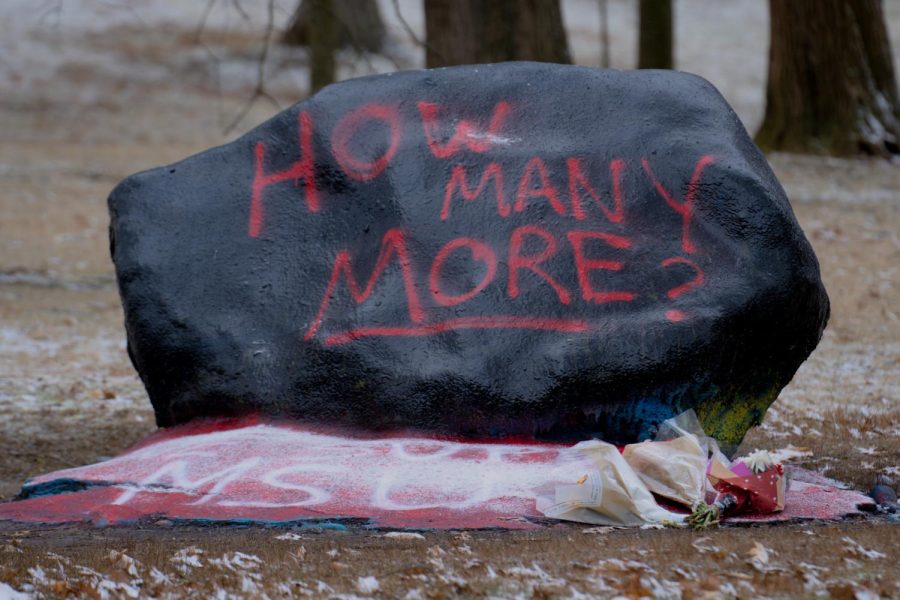 How Many More written on the face of Kent States rock on front campus. The base of the rock is painted with the words, We Support MSU to honor the victims of the recent shooting at Michigan State University on Feb. 13, 2023. The photo was taken on Feb. 17, 2023.