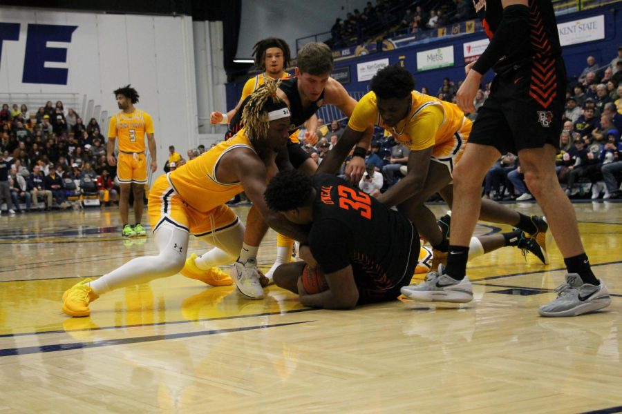Kent State players dive for Bowling Green senior Gabe ONeal to gain possession of the ball during the game on Feb. 7, 2023.