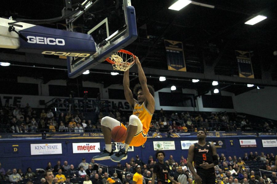 Kent State senior Chris Payton follows through on a dunk during the game against Bowling Green on Feb. 7, 2023.