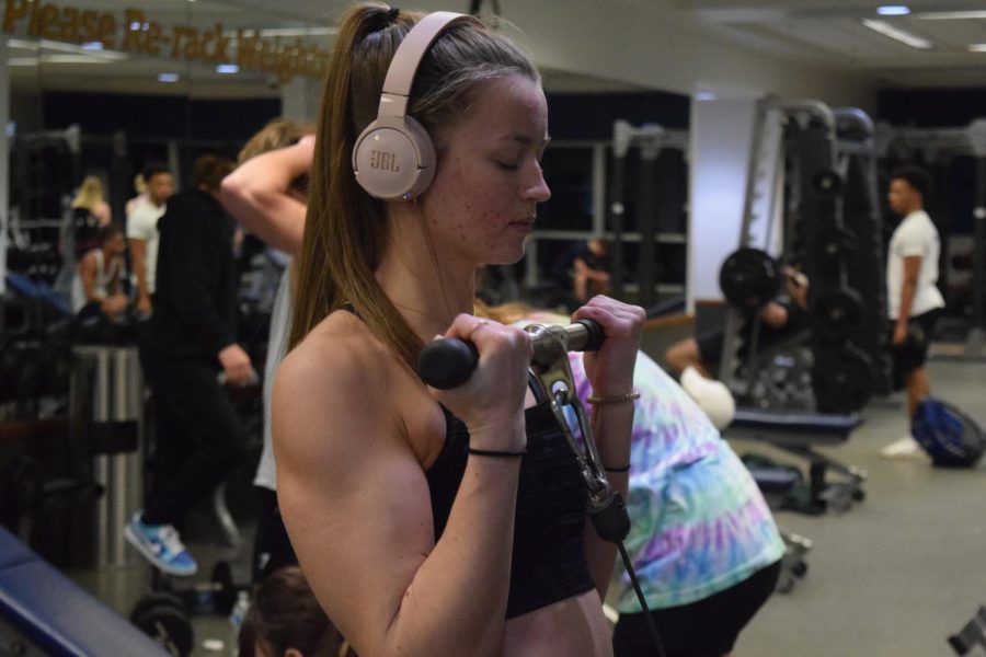Emily Tomasch works her upper body muscles alongside the Ladies Lift group at the REC on Feb. 9, 2023.