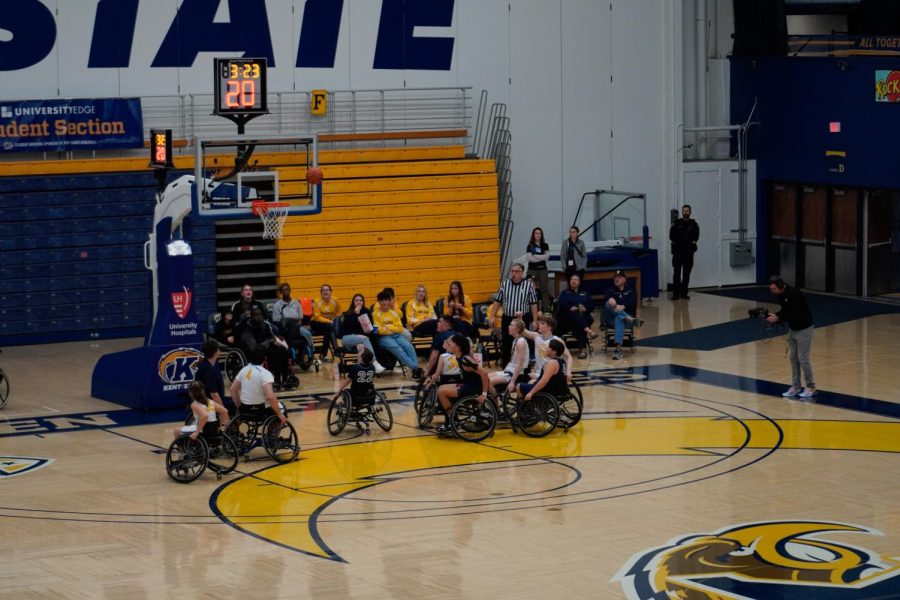 Players on the Wooster Wheelchair Generals and Austintown Wheelchair Falcons watch as a shot from Colin Harrig, a member of the Generals, goes near the hoop on Feb. 25, 2023. 