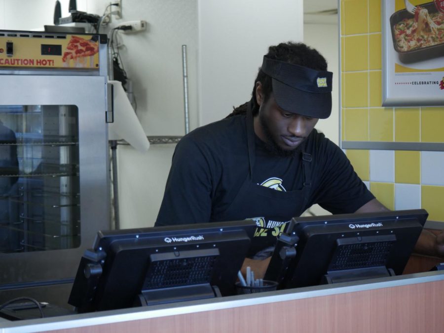 Sam Smith scanning the register at Hungry Howies, located at 1444 E Main St, Kent, OH 44240.