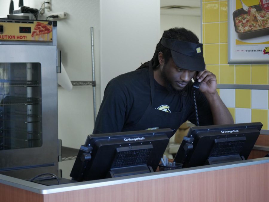 Sam Smith on the phone at Hungry Howies, located at 1444 E Main St, Kent, OH 44240.