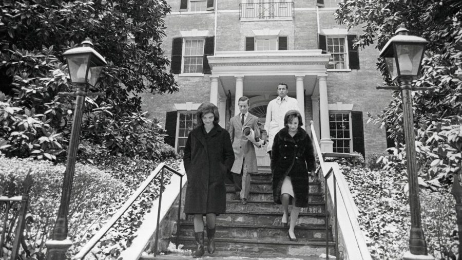 Jacqueline Kennedy, left, and her sister Lee Radziwill, right, are seen leaving the new Georgetown home.
Bettmann Archive/Getty Images