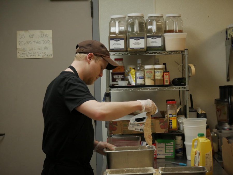 Jacob Schneider prepping chicken at Belleria, located at 135 E Erie St #202, Kent OH 44240.