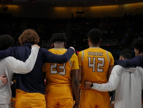 Kent State players embrace during a timeout at Kent States March Madness matchup against Indiana March 17.