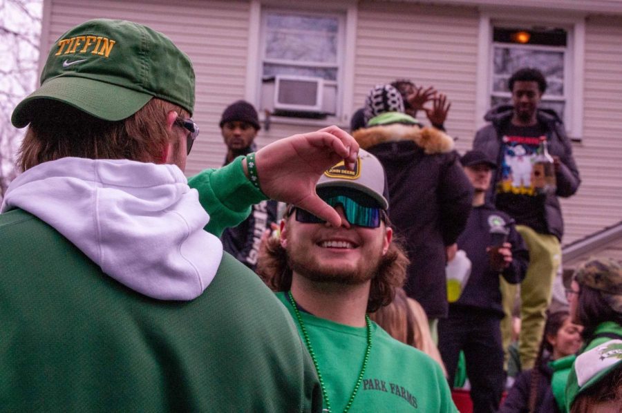 Kent State senior Cole Coppus showing his excitement for Fake Paddys Day at Kappa Sig March 11, 2023. 