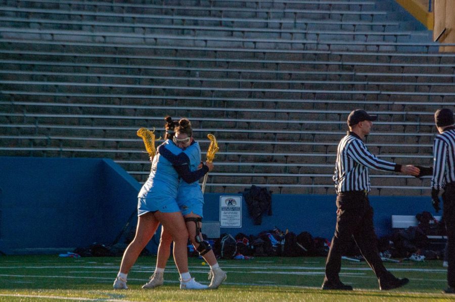 Kent State senior Morgan Kubicki hugged graduate student Claire Welter for her goal against Delaware State on March 8, 2023. 