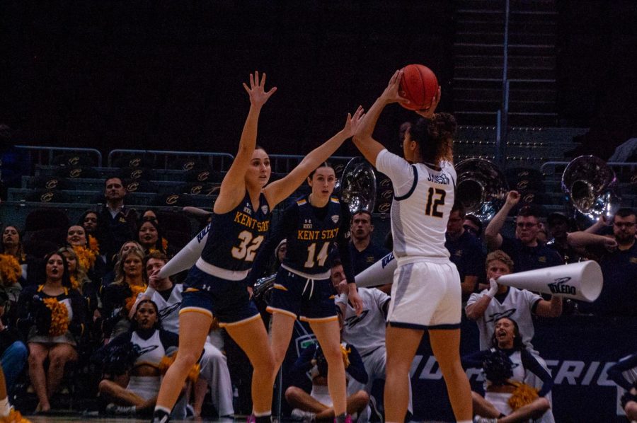 Kent State graduate student Hannah Young and senior Katie Shumate guarding UT Jayda Jansen from making a move during the MAC Tournament Semifinal on March 10, 2023.