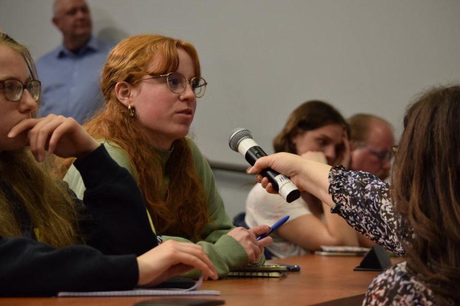 A student from the audience asks Mizell Stewart a question about his experienced with media and ethics after the lecture in Franklin Hall on March 1, 2023