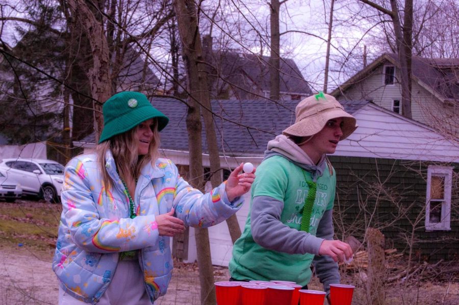Kent State sophomore Abby (no last name) and second-year Gianni Weaver playing a classic game of pong on Fake Paddys March 11, 2023. 