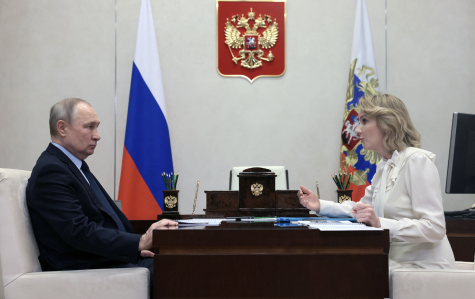 Russian President Vladimir Putin meets with Maria Lvova-Belova, Russian childrens rights commissioner, at the Novo-Ogaryovo state residence, outside Moscow, Russia, on February 16. (Mikhail Metzel/Sputnik/ AFP/Getty Images)