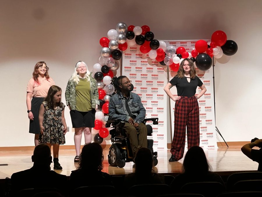 Five of the nine models strut and show off their styled outfits at the Runway of Dreams fashion show April 5 in the KIVA. All of the models in the show are people with disabilities, who are wearing adaptive clothing.