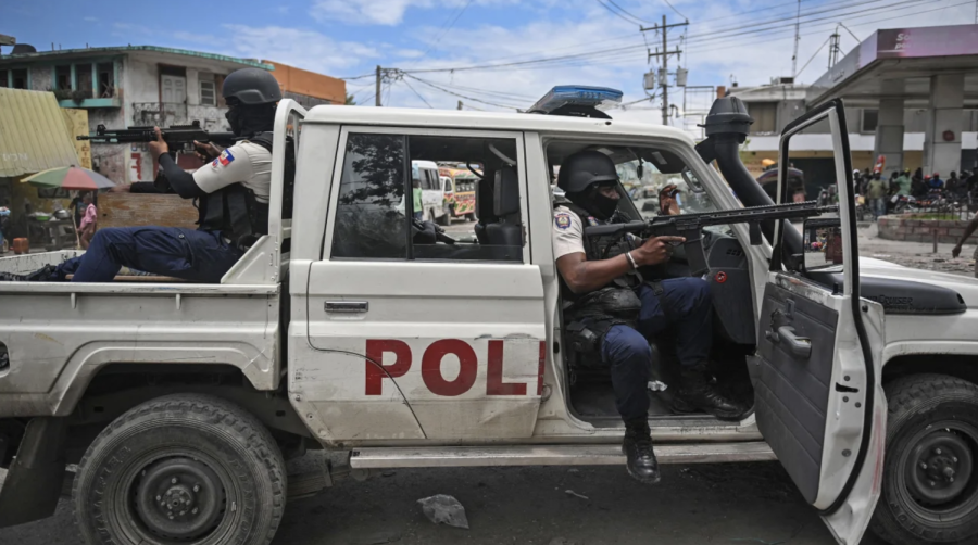 Police officers patrol a neighborhood amid gang-related violence in downtown Port-au-Prince on April 25, 2023.
(Richard Pierrin/AFP/Getty Images)