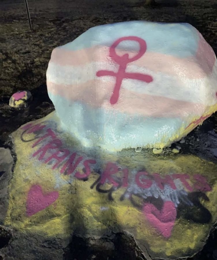 A picture posted to the public Kent State University 2024 Snapchat story. The campus rock was painted with a trans flag shortly after the Kent State College Republicans painted it.