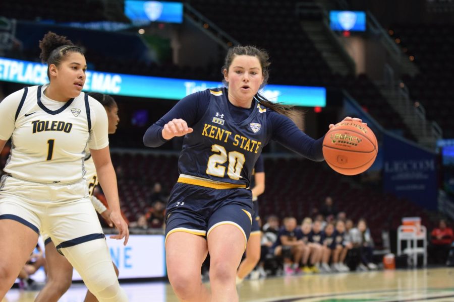 Womens basketball senior guard Clare Kelly dribbles down the court in the semifinal game against The University of Toledo on March 10, 2023. 