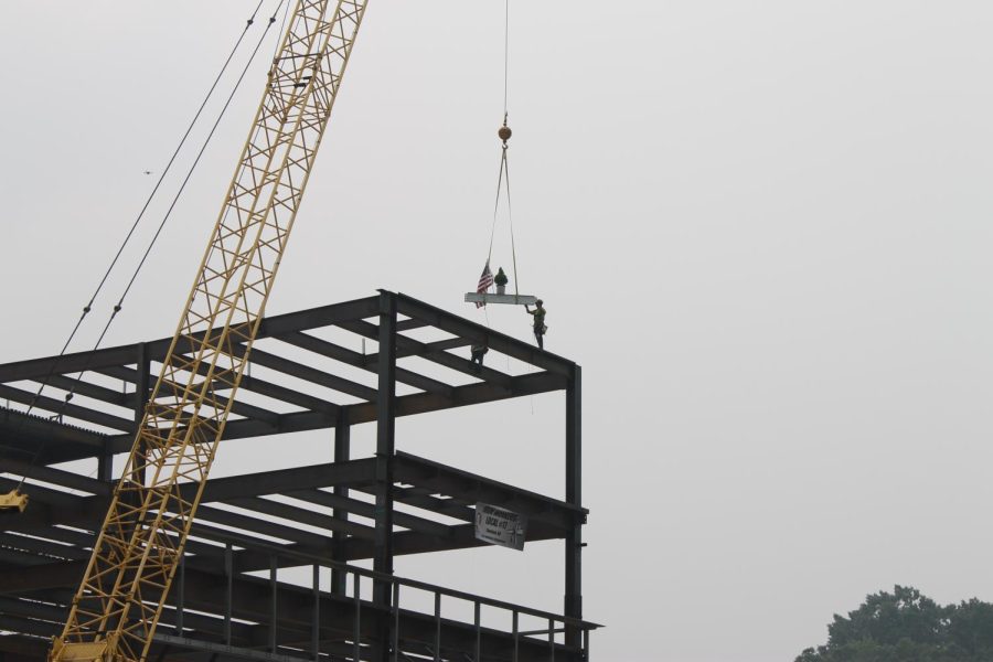 The final beam is placed at the Crawford Hall topping out ceremony on June 28, 2023. The topping out ceremony is a Scandinavian tradition as a tribute to hard work and to bring luck by mounting the top of an evergreen tree to the beam. 