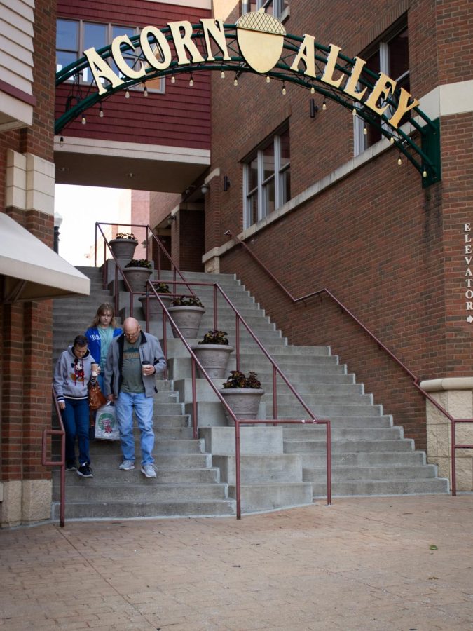 Community members visit local businesses in Acorn Alley in Downtown Kent. 