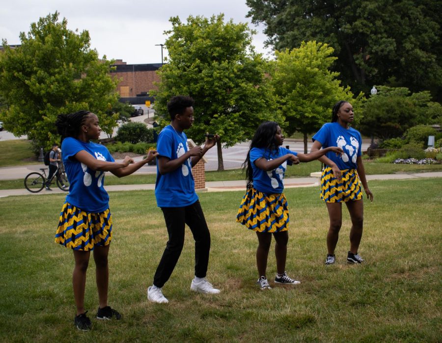 Members, Blair Seu, Nora Sone, Hayden Wilks-Mitchell, and Mikayla Perryman of Barefeet Dance Tribe rehearse before performing at Kent States Juneteenth celebration.