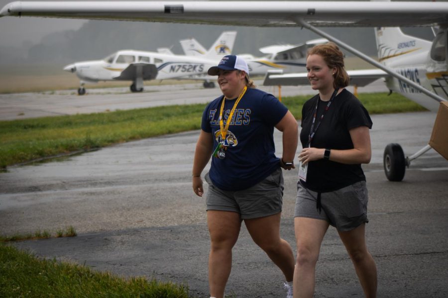 Peyton Turner (left) and Laura Wilson (right) return home after winning air race classic.