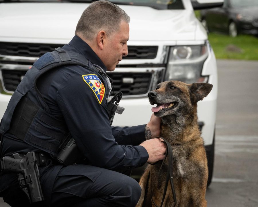 Officer Miguel Witt with Dexter, a K9 who worked for the Kent State Police until his death in April.