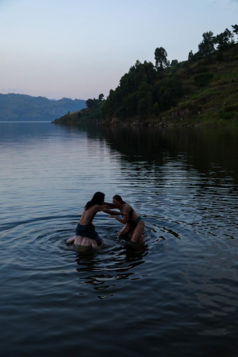 Kent students Miles, Kaleb, Lily and Jordon play chicken in the lake at Twin Lakes, Rwanda.