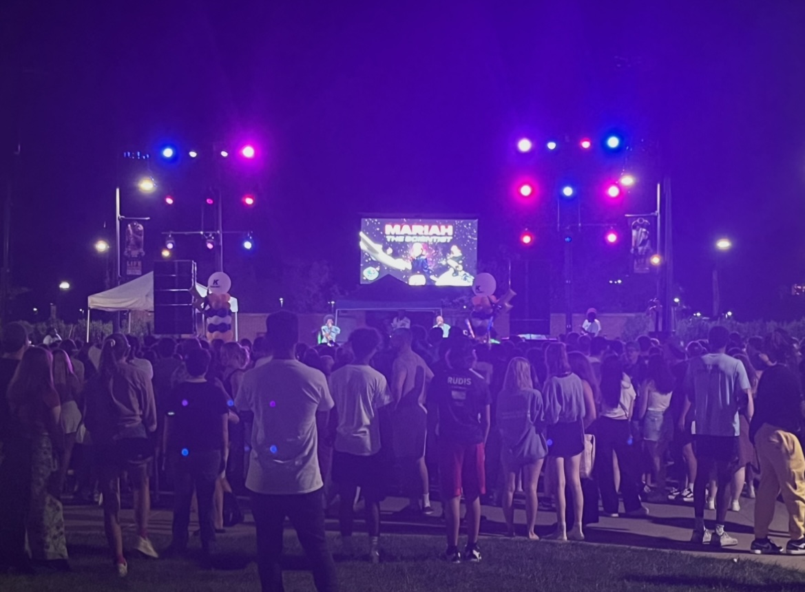 Students come together on Rismen Plaza Aug. 20, 2023 to see the announcement of "Mariah the Scientist," set to play at the university's Homecoming concert. 