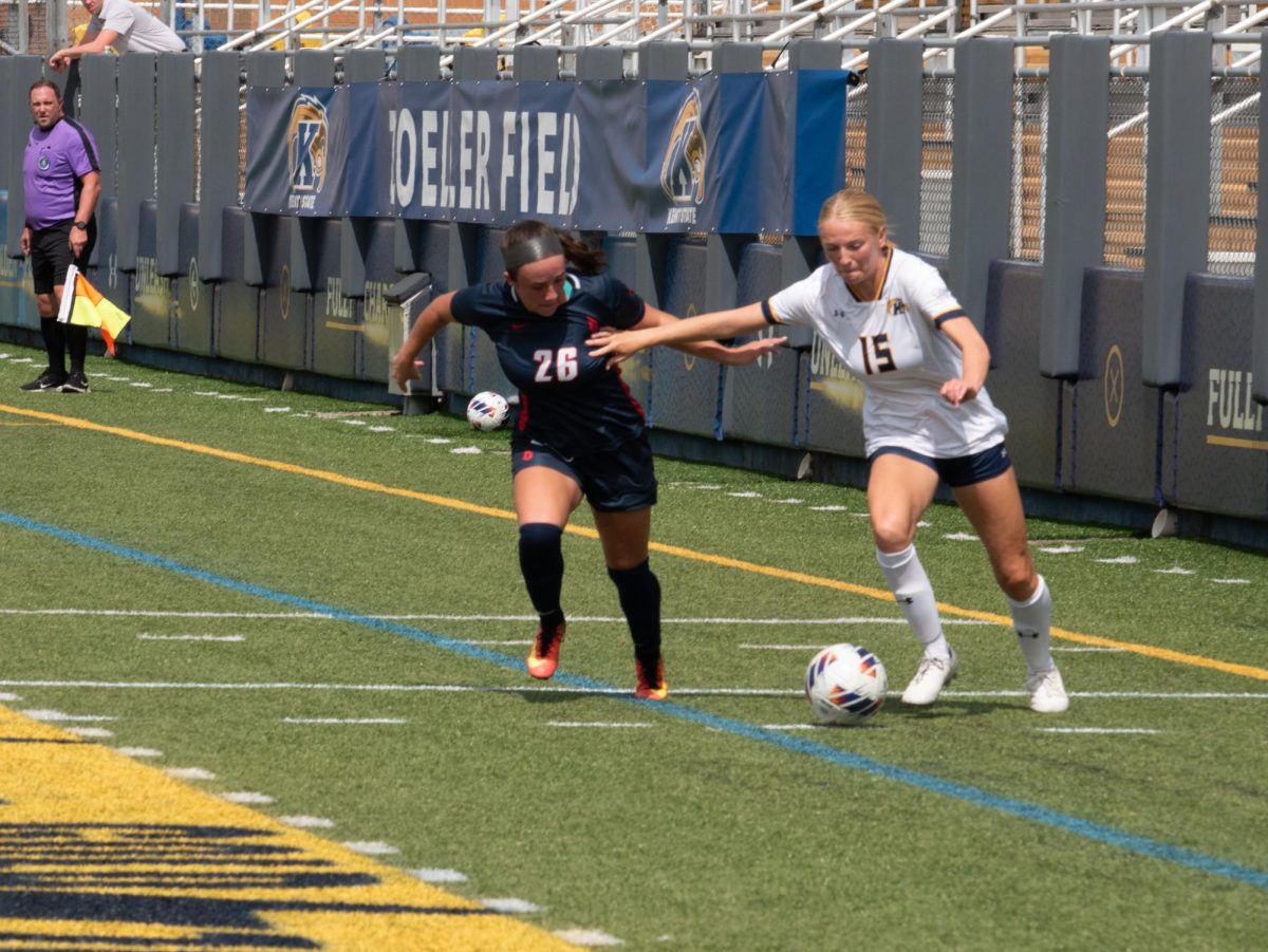 Mary Kate Lape (right) fends off Devin Lillis (left) at Kent States senior day matchup against Duquesne Sep. 10, 2023.