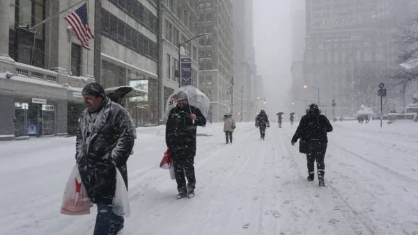 People walk on snow as a winter storm hits New York City on January 23, 2016, during what was an El Niño winter.