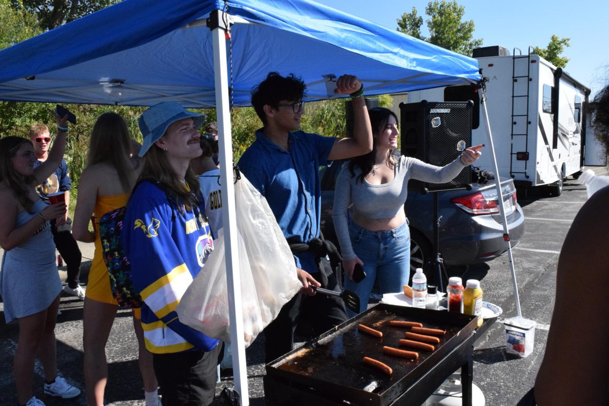 Kent State students cook hotdogs outside of Dix Stadium on Spet. 16, 2023 while they wait for the football game to start.