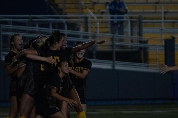 The Kent womens soccer team celebrate after team member Abby Breitschuh scored the winning goal with just 48 seconds left on the clock on Sept. 28th. The team won 2-1 against Eastern Michigan. 