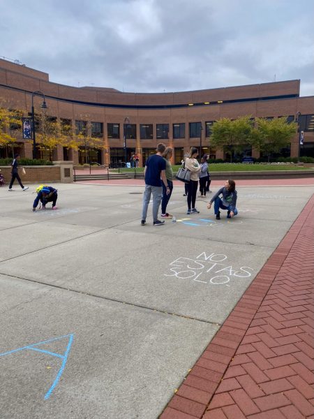 Students use chalk to write messages on the Risman Plaza during Active Minds at KSUs suicide awareness walk on Sept. 26, 2023.