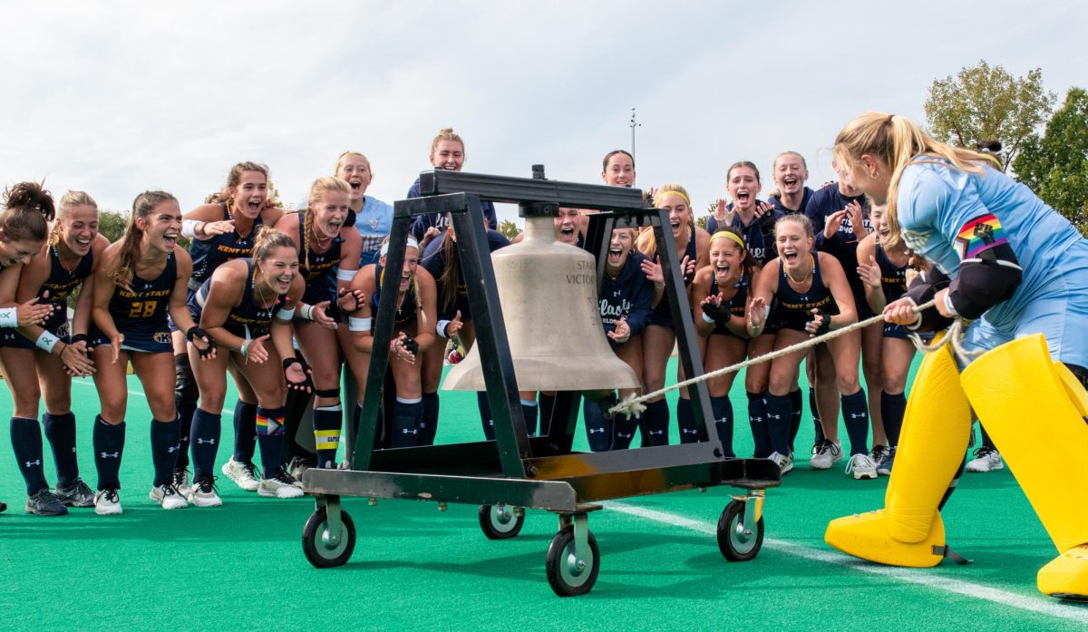 The Kent State field hockey team ring the bell after securing a victory against Miami on Oct 13, 2023. The Golden Flashes won the game 2-1.
