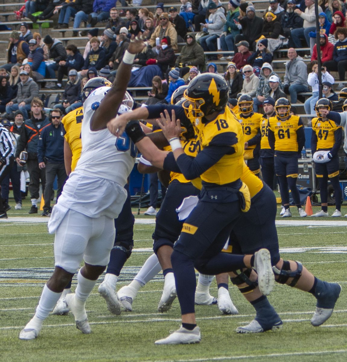 Redshirt junior quarterback Michael Alaimo throws a pass while freshman offensive lineman Andrew Page keeps Buffalo defensive lineman Daishon Folsom off his quarterback during the Kent State vs. Buffalo football game on Oct. 21, 2023.