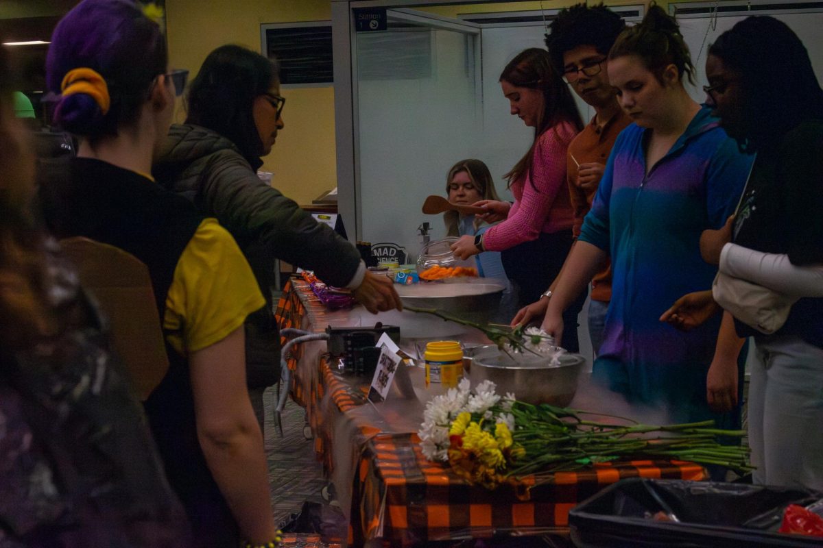There were multiple stations set up around the library, some featuring crafts, others with sweet treats at the University Library Halloween Party on Friday, Oct. 27, 2023.