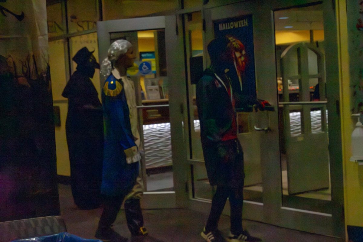 A group of students entered the library to join the fun at the University Library Halloween Party on Friday, Oct. 27, 2023.