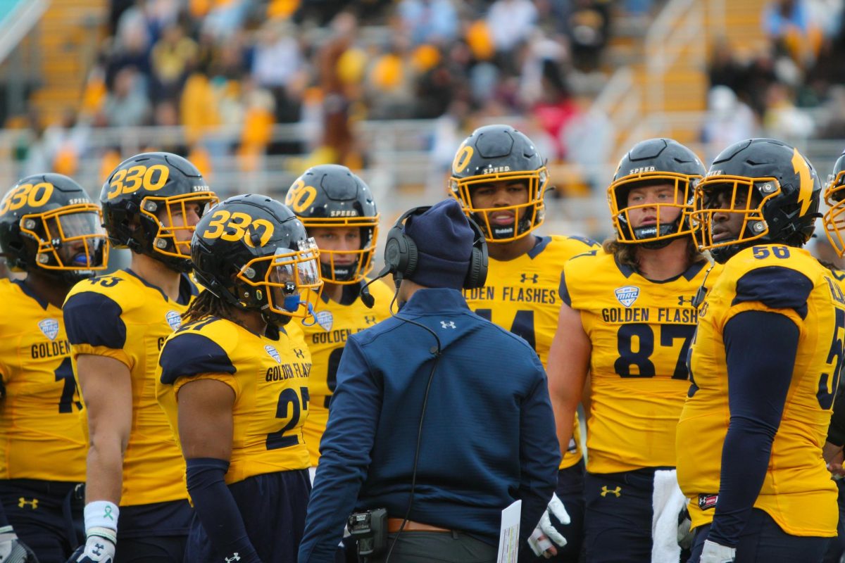 Kent State rush ends coach CJ Robbins speaks with the football team during the homecoming game on Oct. 21, 2023.
