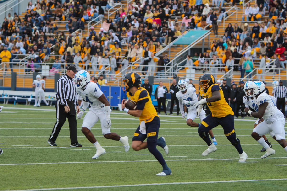 Kent State runs the ball downfield against the University of Buffalo on Oct. 21, 2023.