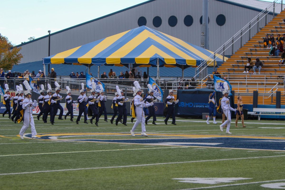 The Kent State marching band enters the field for pregame during the homecoming game on Oct. 21, 2023.