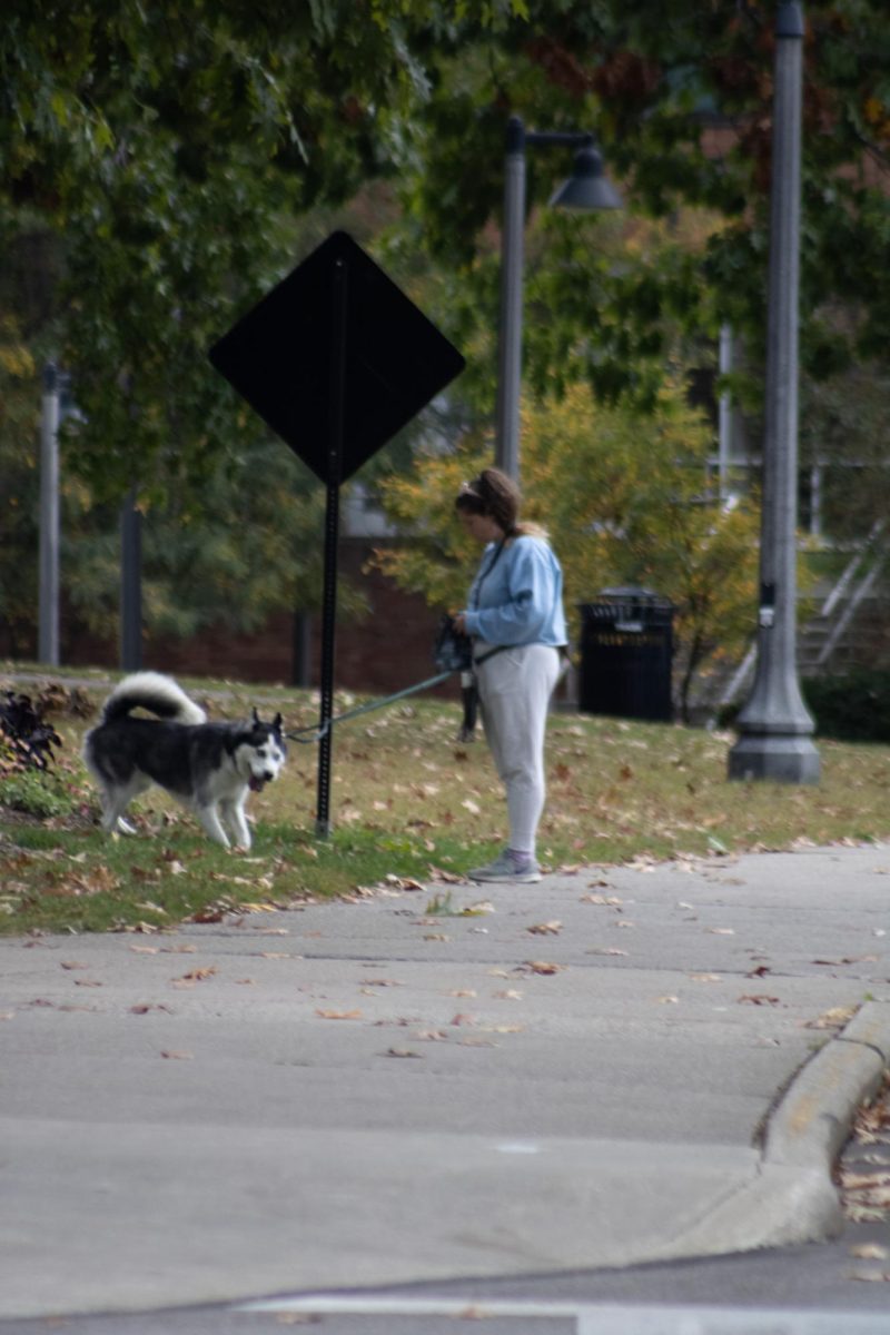 Kent State student and their dog out for a walk during Fall Break on October 7, 2023.