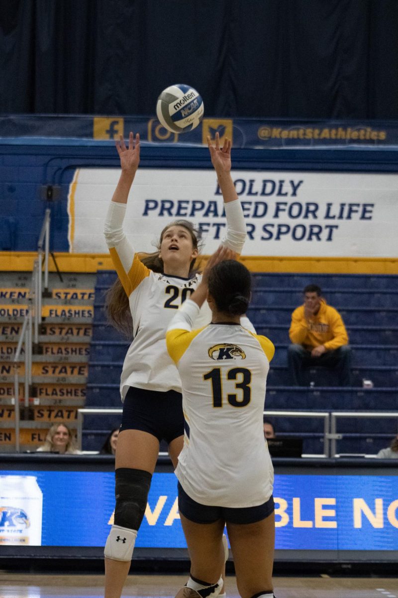 Kent State sophomore Kendall White sets to graduate student Burgundy Walters in the volleyball game against Miami on Oct. 13, 2023.