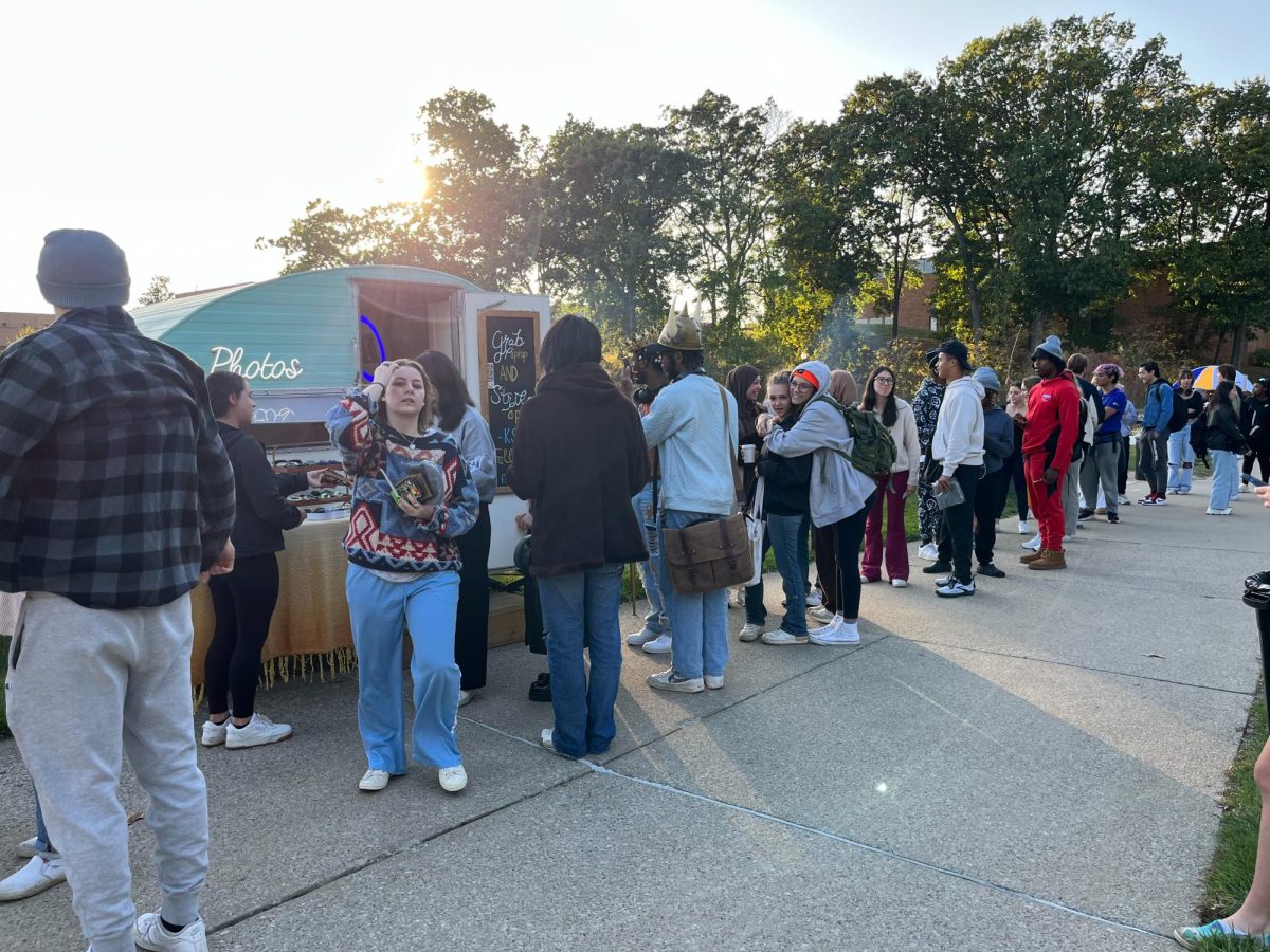 Attendees line up for the photo booth at FABs Fall Fest event on Oct. 11, 2023.