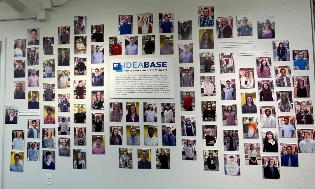 Pictures displaying IdeaBases past and present employees hang on the wall during the firms 10 year anniversary celebration on Oct. 20, 2023. 