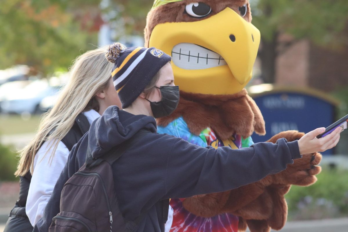 Flash takes a selfie with students before the rainbow run.