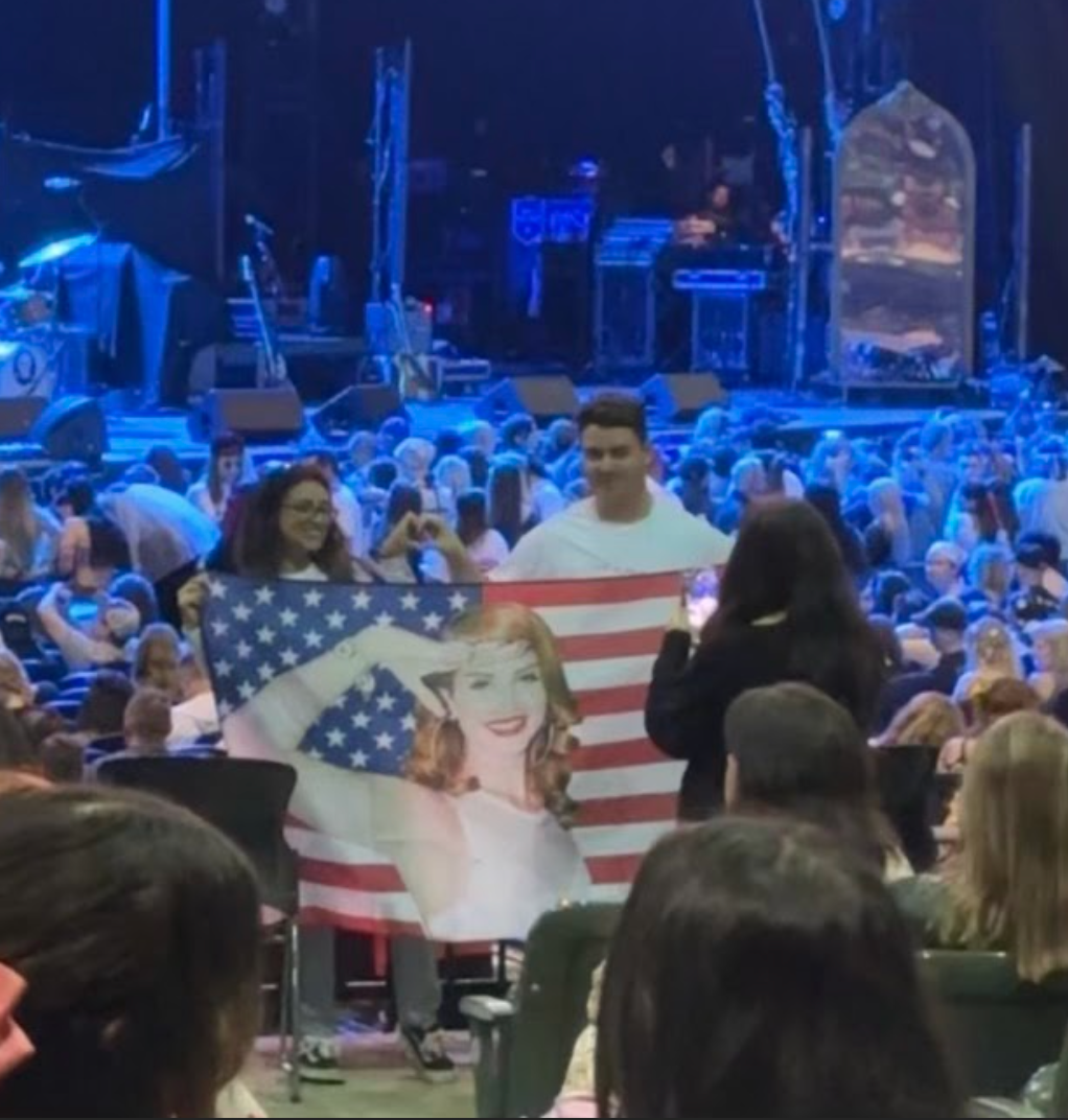 Fans show off their Lana Del Ray flag.